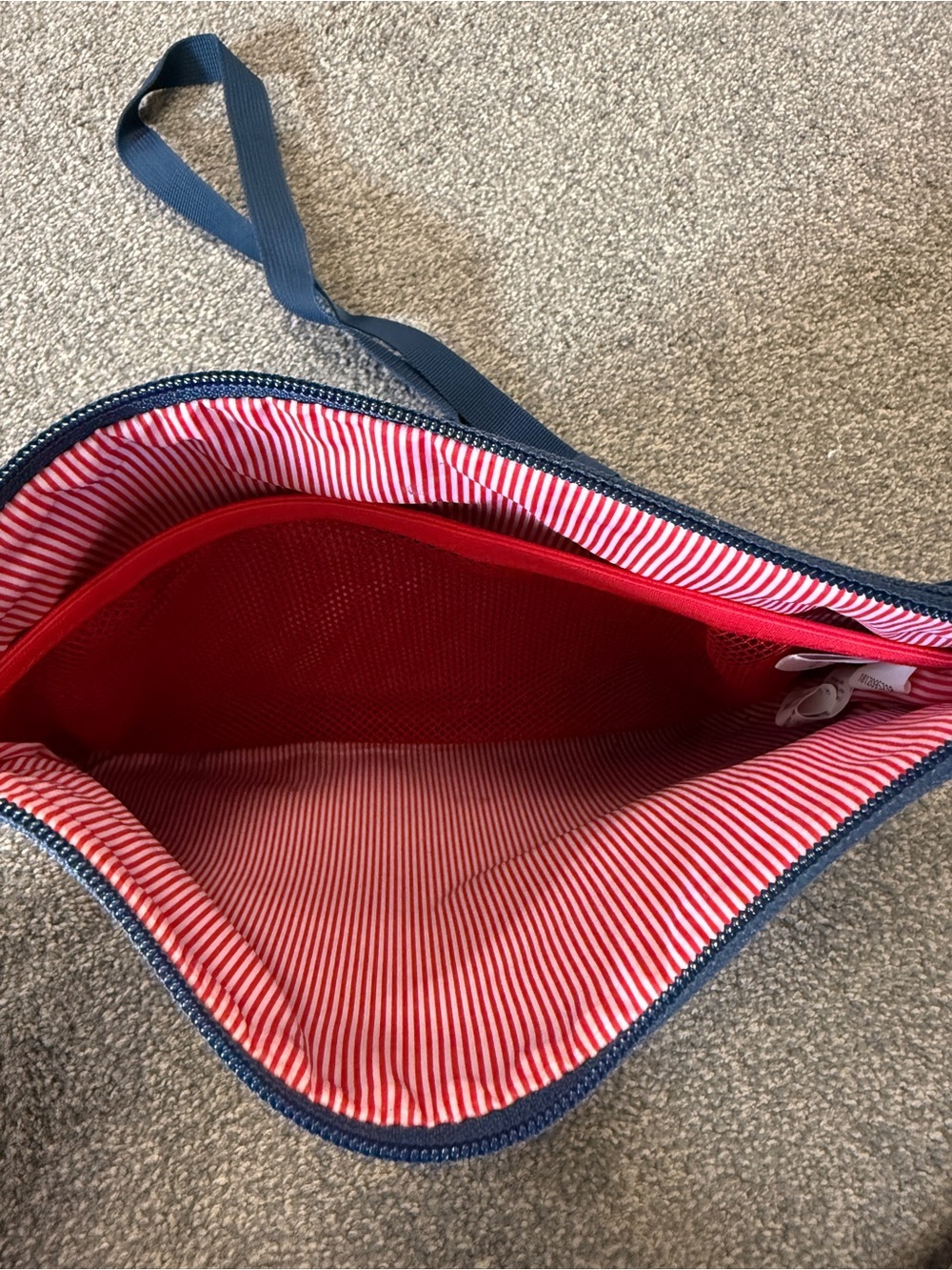 Herschel navy blue crossbody bag with red/white striped lining - Picture 3 of 3